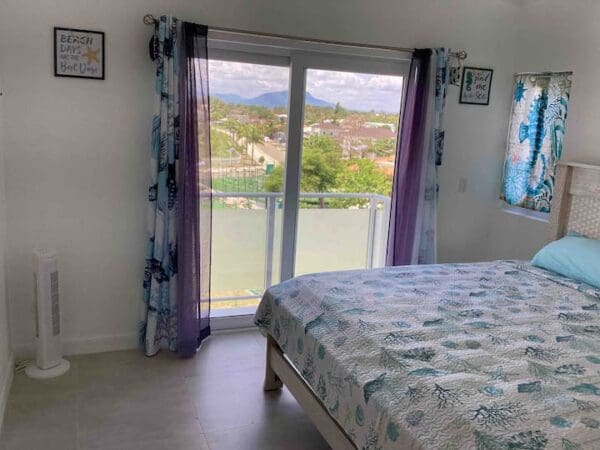 A bedroom with a view of the mountains.