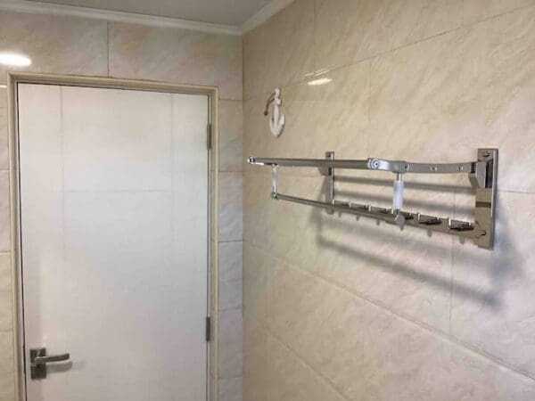 A bathroom with a shower and tiled walls.