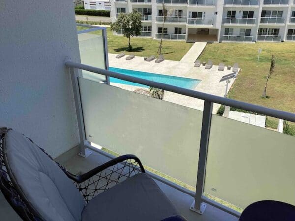 A view of the pool from an apartment balcony.