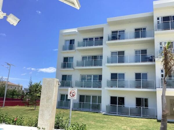 A building with many windows and balconies on the outside.