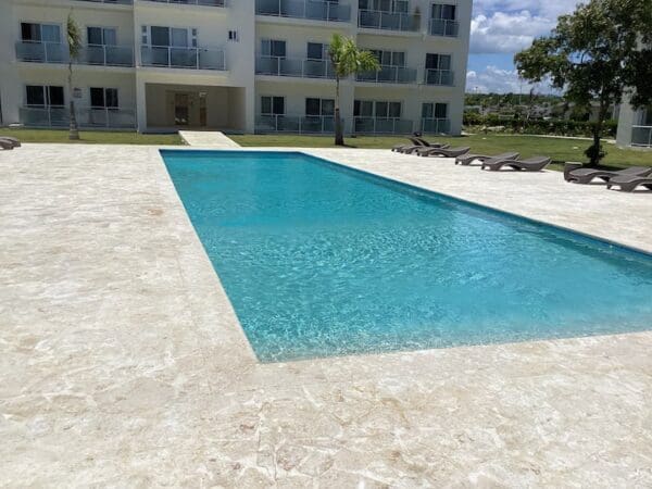 A pool with a view of the building.