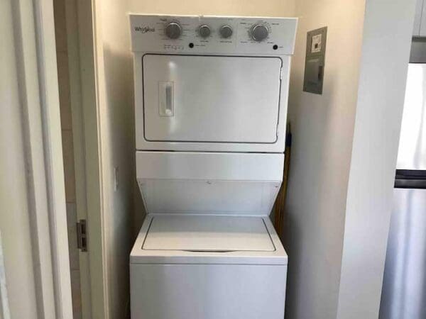 A white washer and dryer in a room.