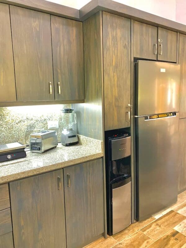 A kitchen with wooden cabinets and stainless steel appliances.